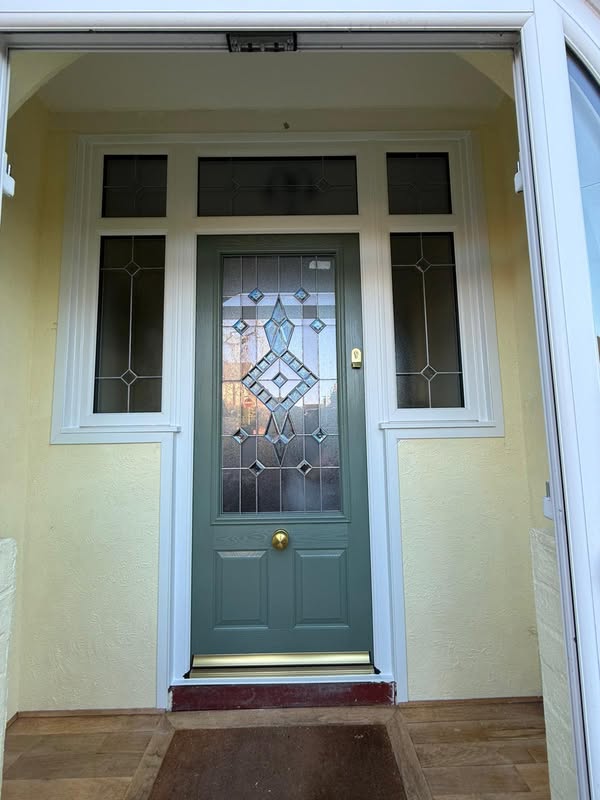 Green composite door with glass panel